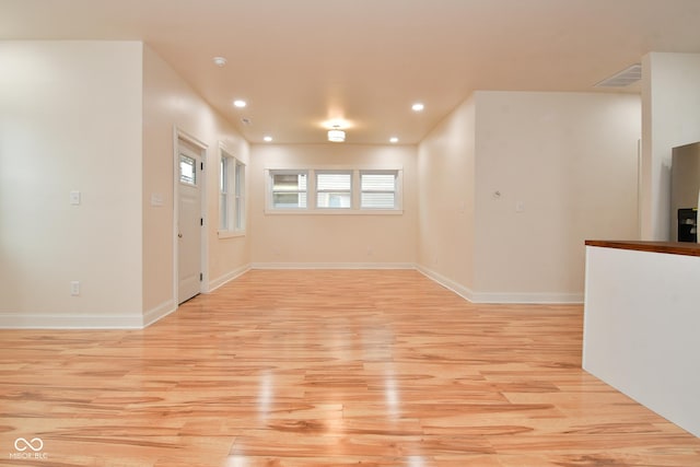 547 Udell St, Indianapolis, IN 46208 - unfurnished living room with light wood-style flooring, recessed lighting, and baseboards