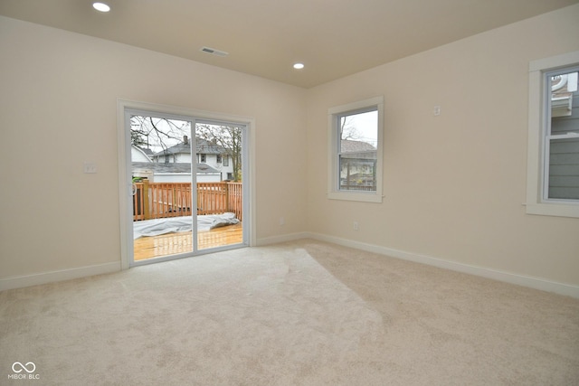 547 Udell St, Indianapolis, IN 46208 - spare room with healthy amount of natural light, light carpet, baseboards, and recessed lighting