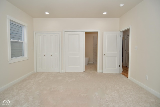547 Udell St, Indianapolis, IN 46208 - unfurnished bedroom with light carpet, multiple closets, baseboards, and recessed lighting
