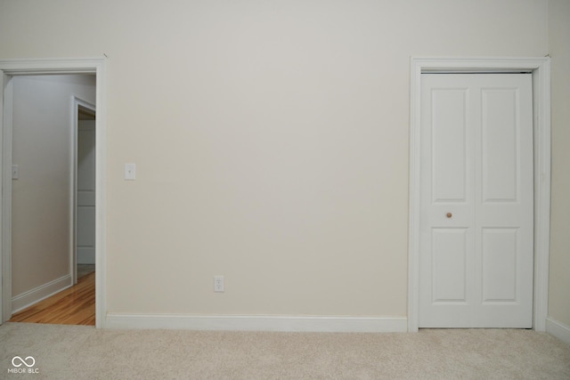547 Udell St, Indianapolis, IN 46208 - unfurnished bedroom with carpet floors, baseboards, and a closet