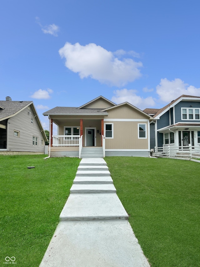 547 Udell St, Indianapolis, IN 46208 - view of front of property featuring covered porch and a front yard