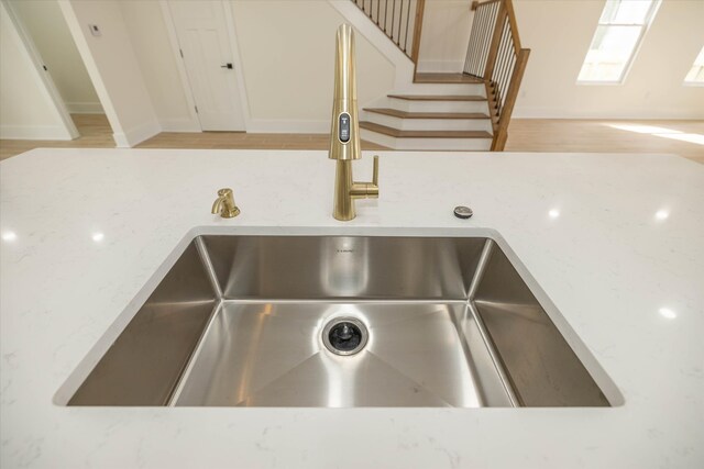 interior details featuring light hardwood / wood-style floors and sink