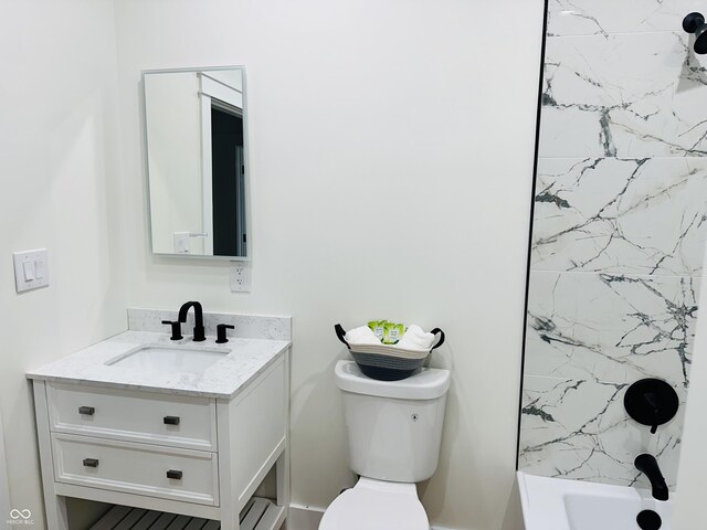 full bathroom with shower / tub combination, vanity, and toilet