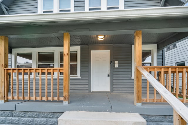 property entrance with covered porch