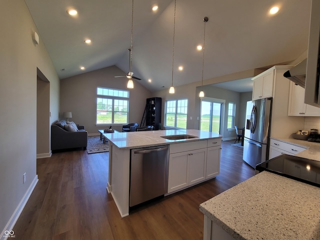 kitchen with pendant lighting, white cabinetry, a center island, and stainless steel appliances