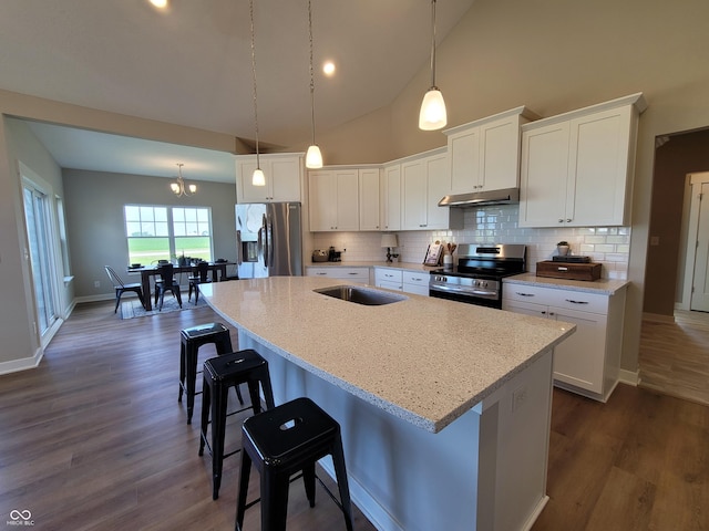 kitchen with white cabinetry, a kitchen island with sink, and appliances with stainless steel finishes