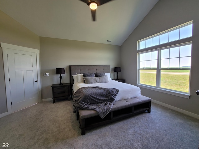 carpeted bedroom featuring ceiling fan and vaulted ceiling