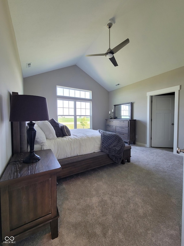 carpeted bedroom with vaulted ceiling and ceiling fan