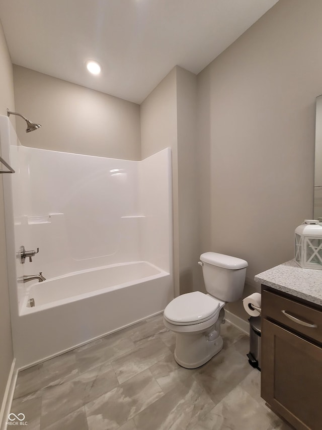 full bathroom with vanity, shower / bathtub combination, and toilet