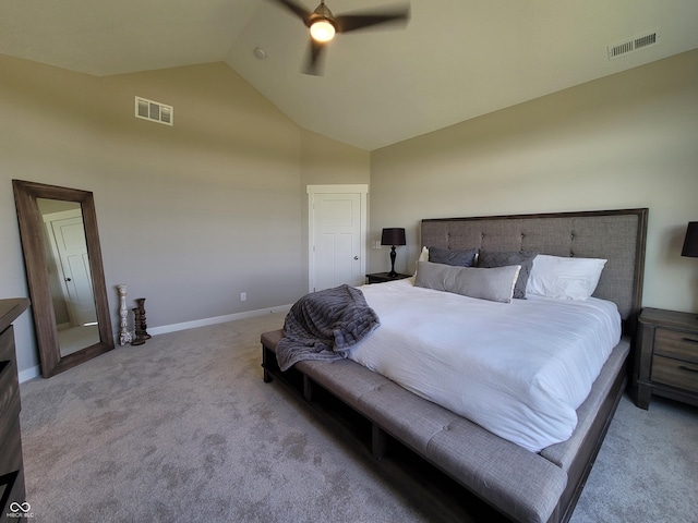 carpeted bedroom with ceiling fan and high vaulted ceiling