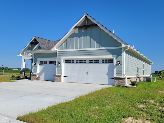 view of front of property featuring a garage and cooling unit