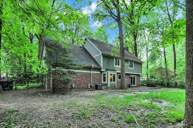 back of property with central AC unit