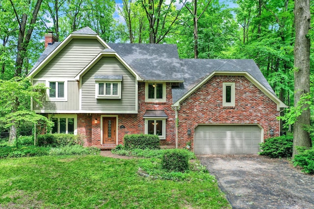 front facade featuring a garage and a front yard