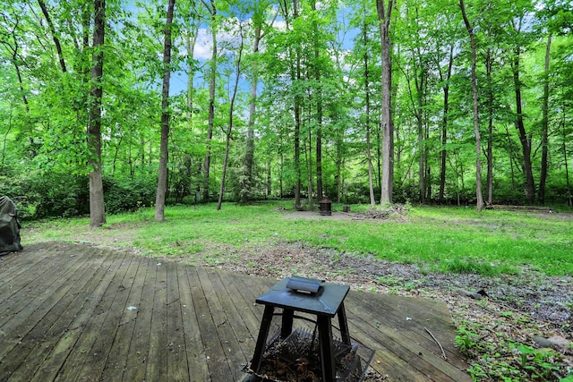 wooden terrace featuring a fire pit