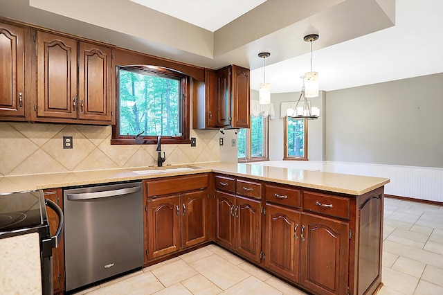 kitchen featuring range with electric cooktop, pendant lighting, dishwasher, sink, and kitchen peninsula