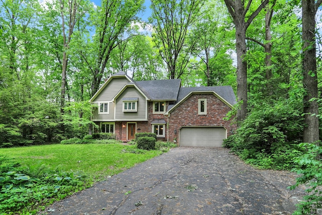 front facade with a garage and a front lawn