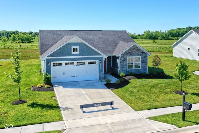 craftsman inspired home with a garage and a front yard