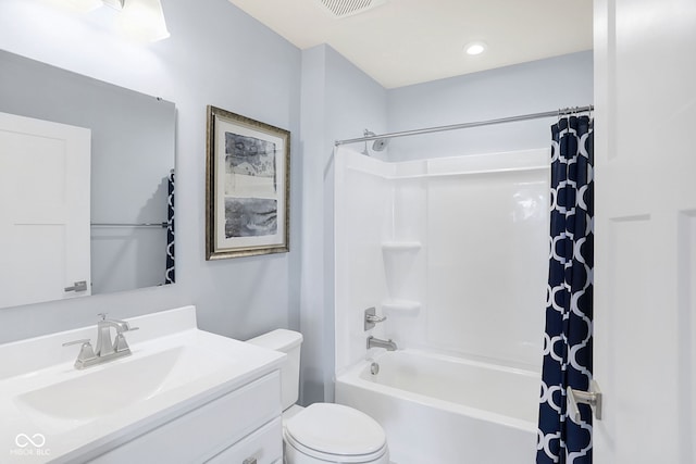 full bathroom with toilet, vanity, and shower / tub combo with curtain