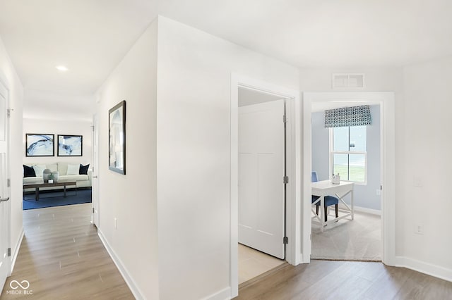 hallway featuring light hardwood / wood-style floors