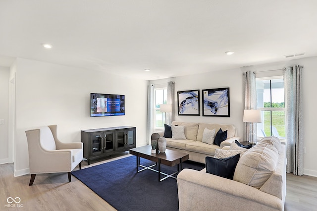 living room with light hardwood / wood-style floors