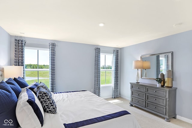 bedroom with light colored carpet