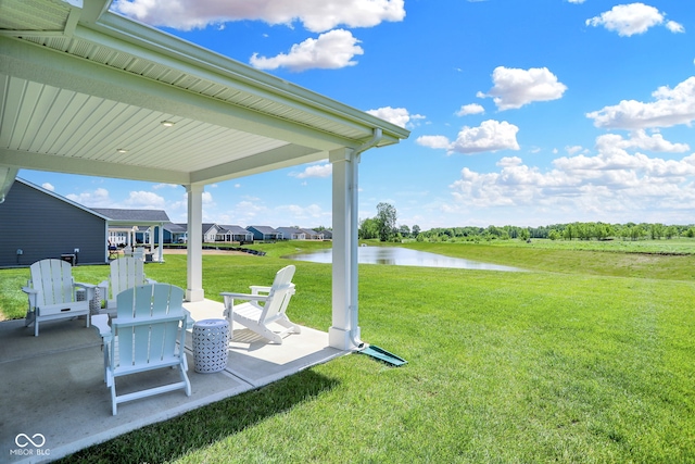 view of yard featuring a patio and a water view