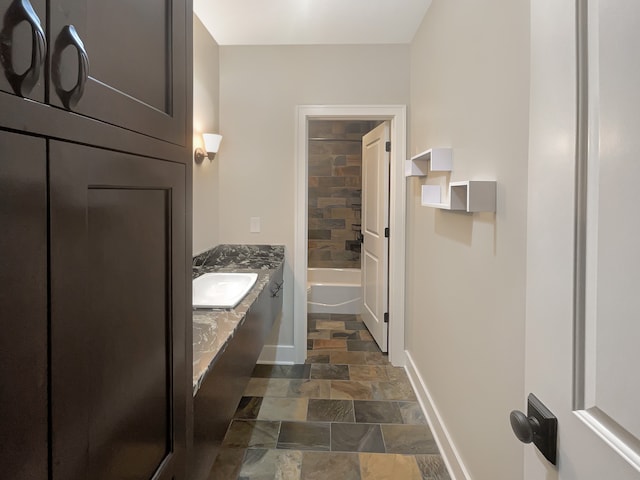 bathroom with tile floors, tub / shower combination, and vanity