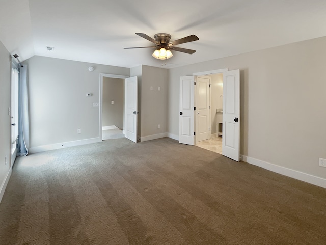 unfurnished bedroom with vaulted ceiling, carpet, and ceiling fan