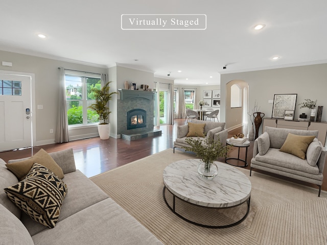 living room with crown molding and wood-type flooring