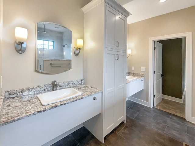 bathroom with tile flooring and large vanity