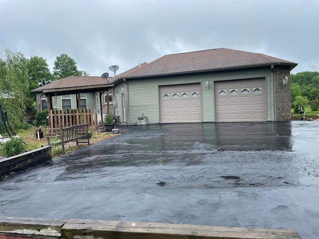 single story home featuring a garage