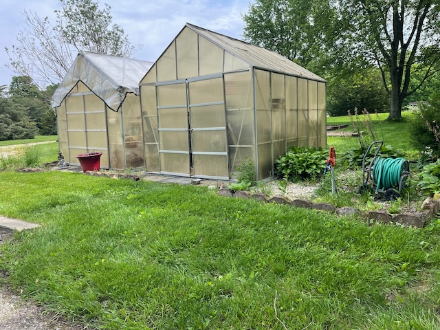 view of outdoor structure with a yard