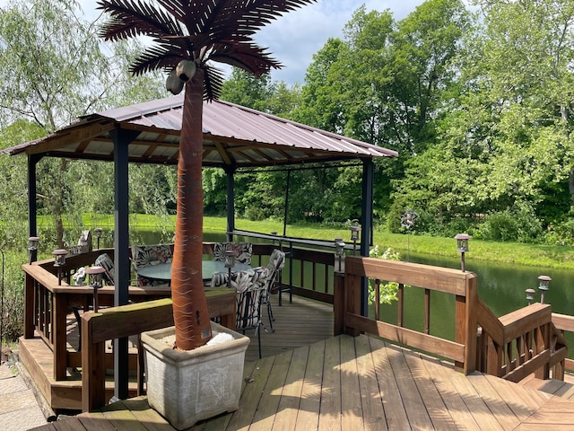 wooden deck with a gazebo and a water view