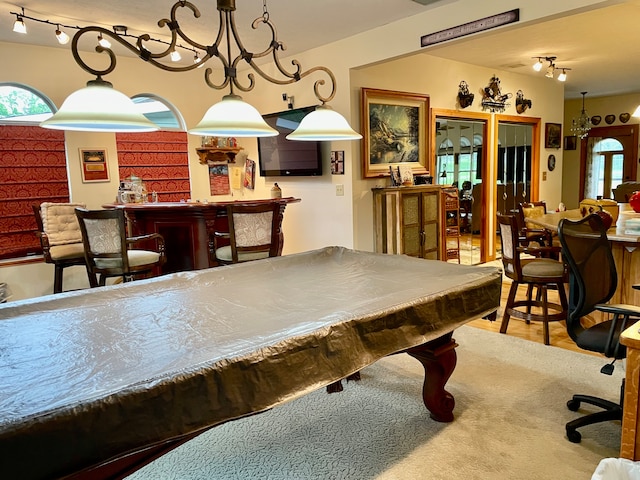 playroom featuring plenty of natural light, wood-type flooring, billiards, and indoor bar