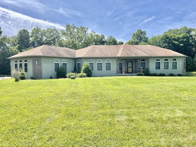 ranch-style house with a front lawn