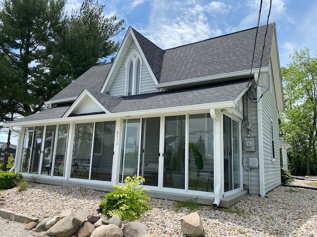 back of property featuring a sunroom