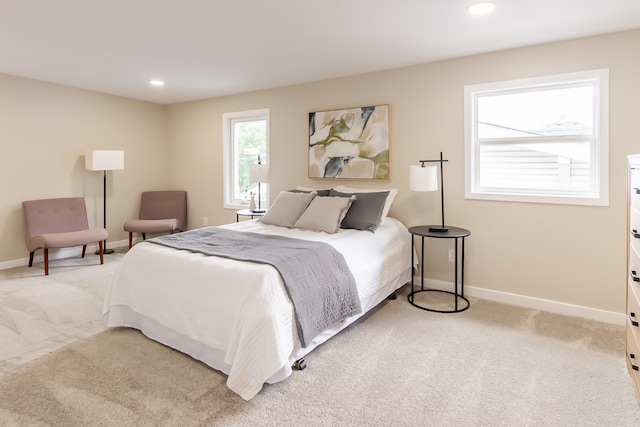 bedroom with light carpet