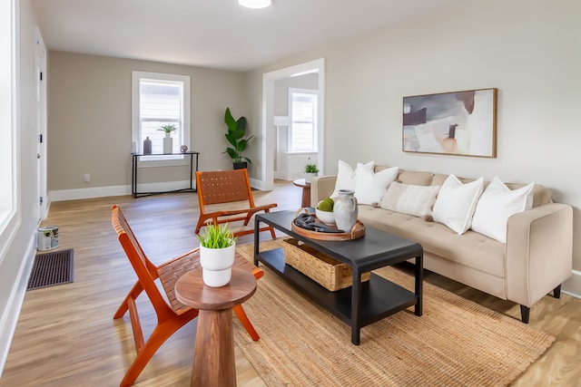 living room with light hardwood / wood-style floors