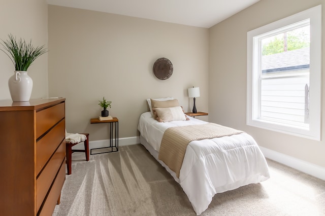 bedroom with light carpet