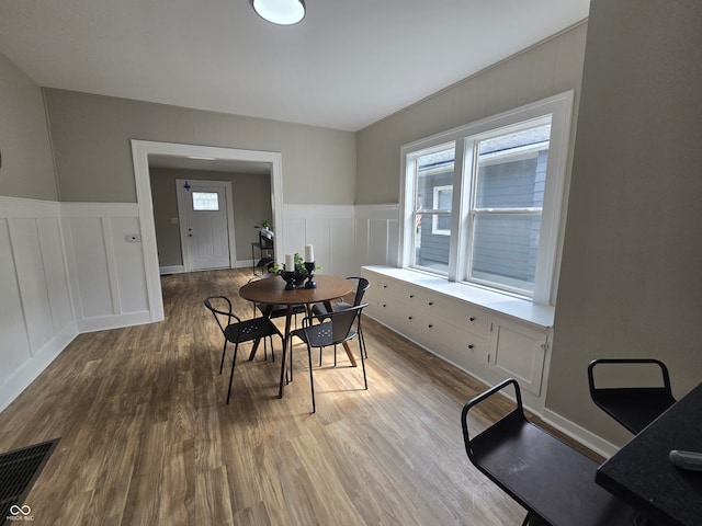 dining area featuring a wealth of natural light and hardwood / wood-style flooring