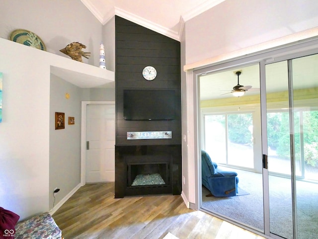 living room featuring ornamental molding, a large fireplace, lofted ceiling, and hardwood / wood-style flooring