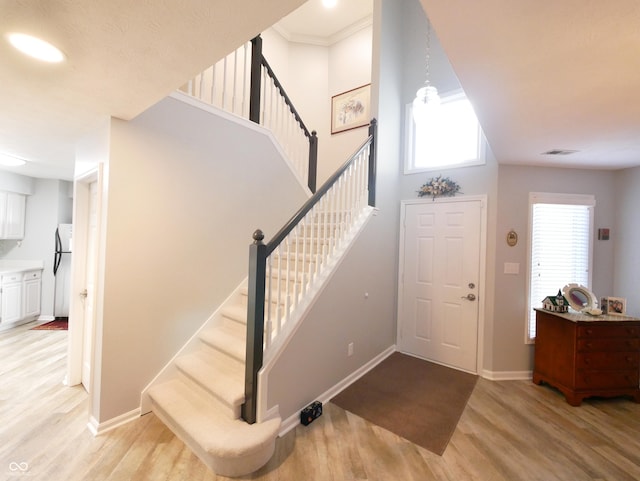 entryway with light hardwood / wood-style floors