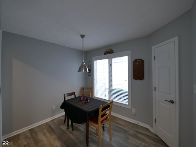 dining area featuring dark hardwood / wood-style floors