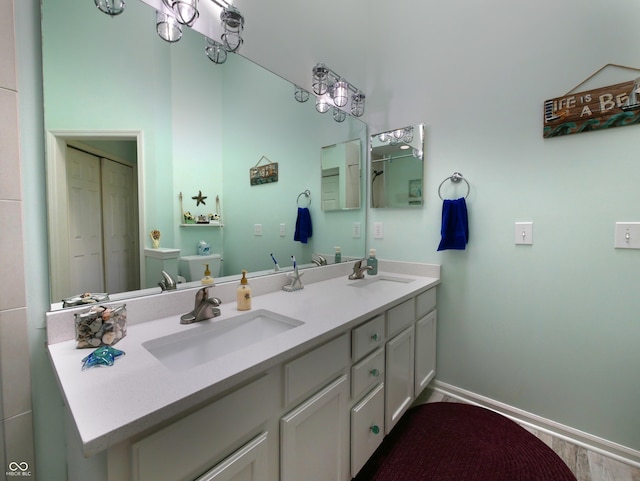 bathroom with hardwood / wood-style floors, vanity, and toilet