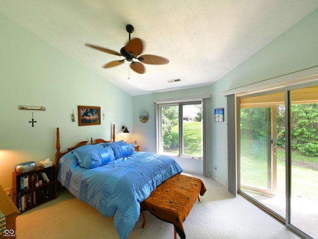 carpeted bedroom featuring ceiling fan, lofted ceiling, and access to outside