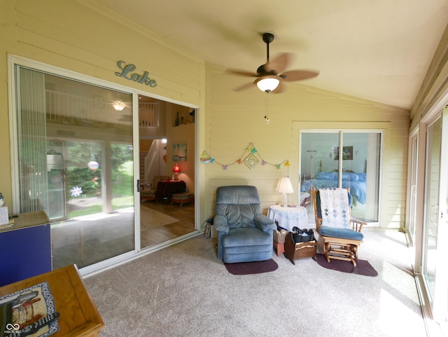 sunroom featuring lofted ceiling and ceiling fan