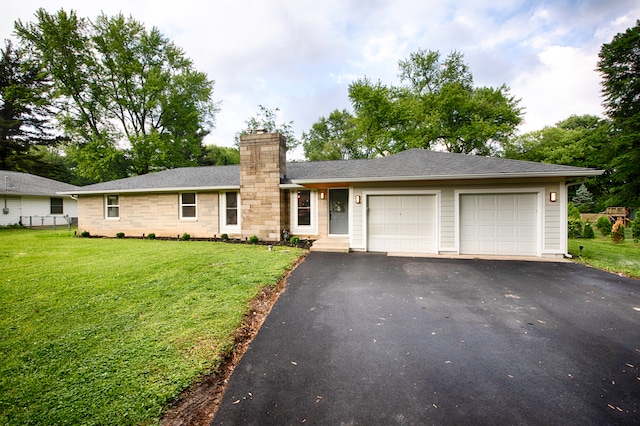 single story home with a front lawn and a garage