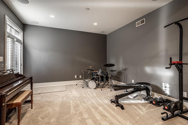 exercise room with carpet floors