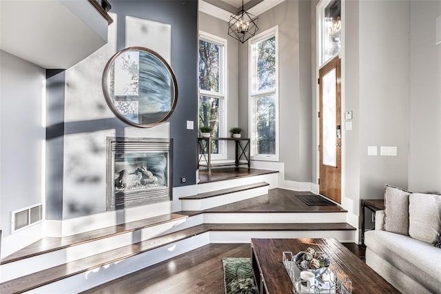 interior space with a chandelier and wood-type flooring