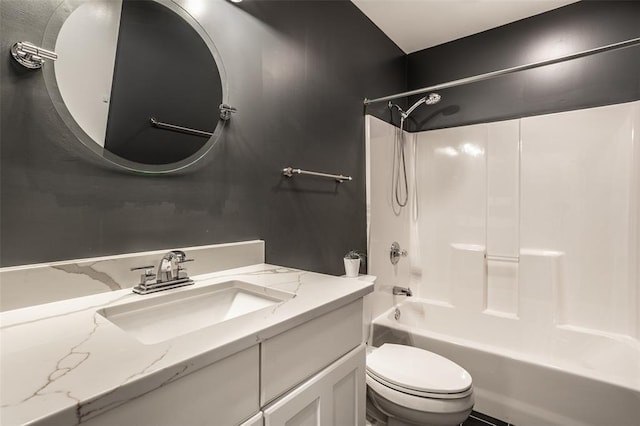 full bathroom featuring washtub / shower combination, oversized vanity, and toilet